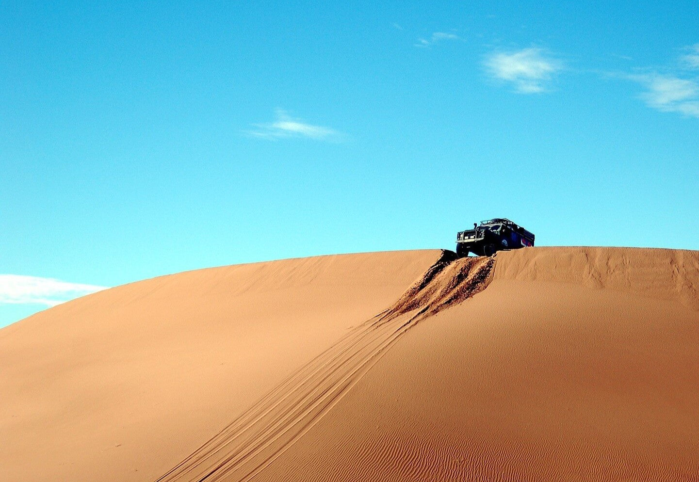 Car driving through remote desert Stellar